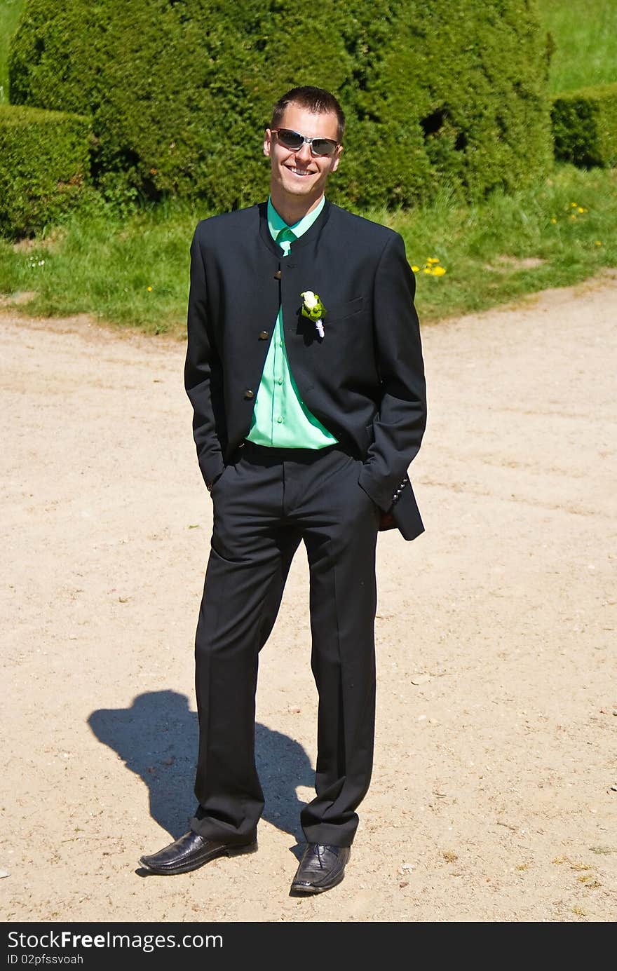 Smiling happy groom in the garden. Smiling happy groom in the garden