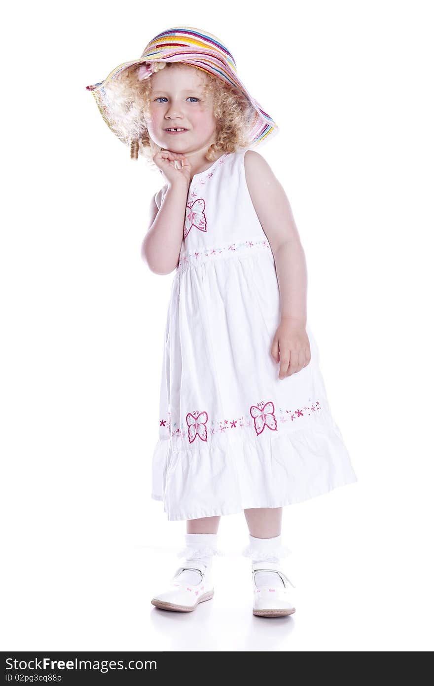 Small smiling baby in white dress on white background