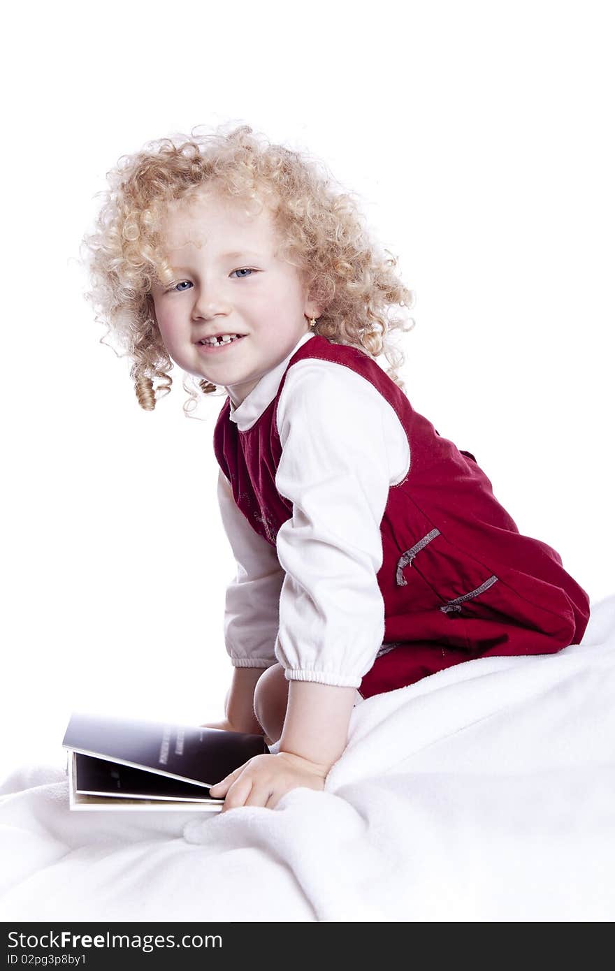 Small smiling baby in red dress on white background