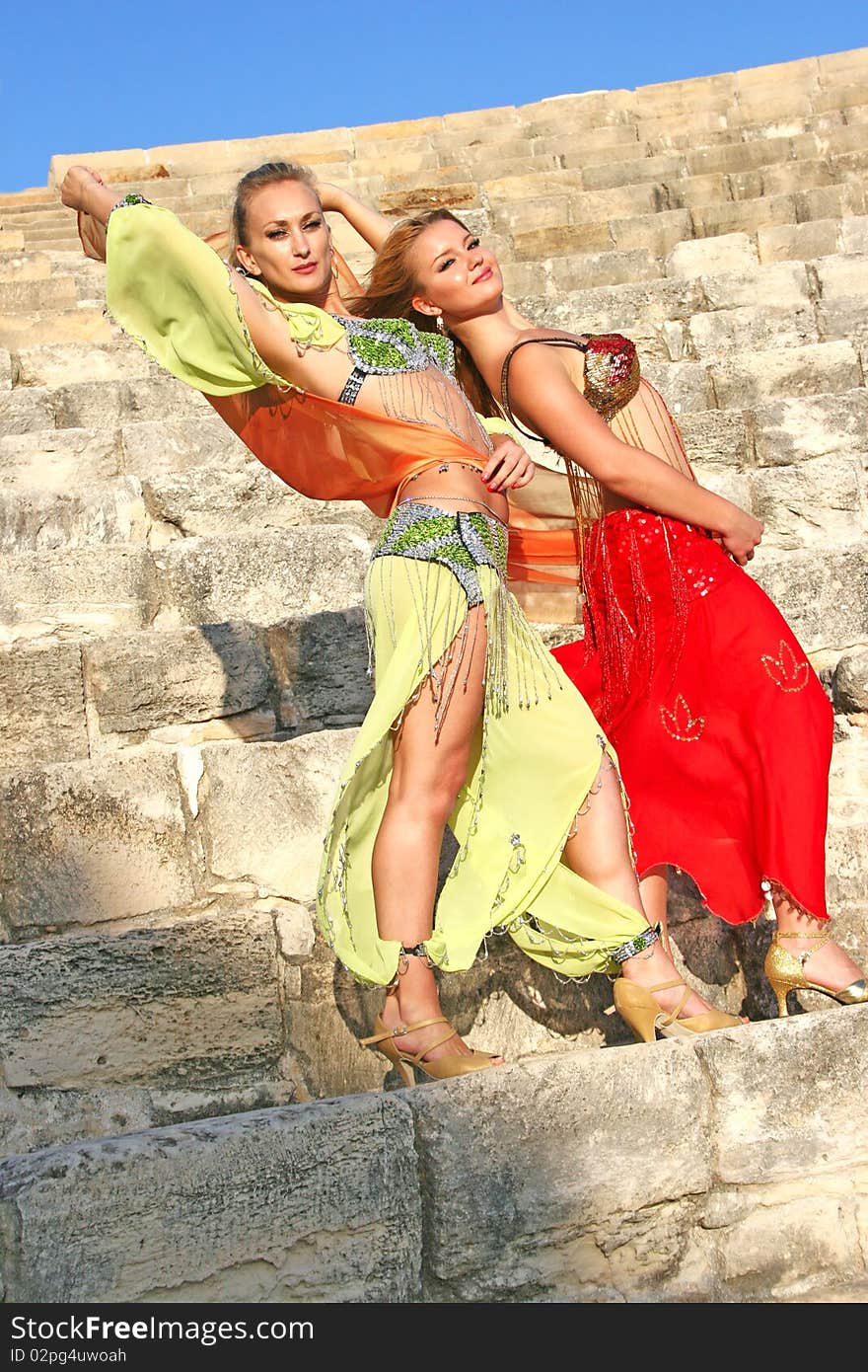 Beautiful belly dancers on the ancient stairs of Kourion amphitheatre in Cyprus.