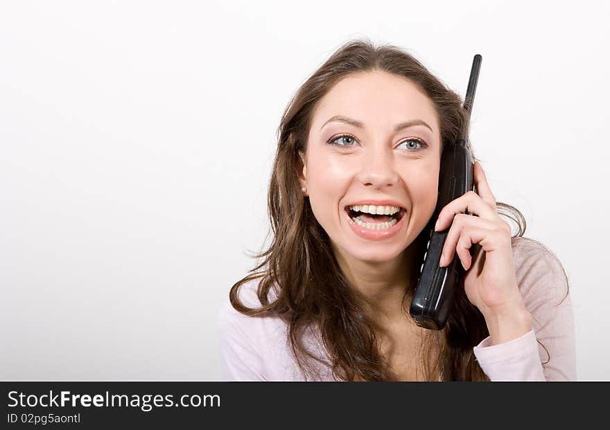 Beautiful girl with phone on white