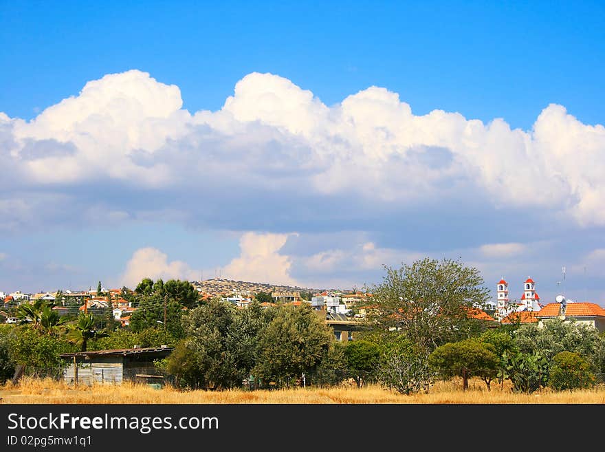 Landscape with clouds and rural place.