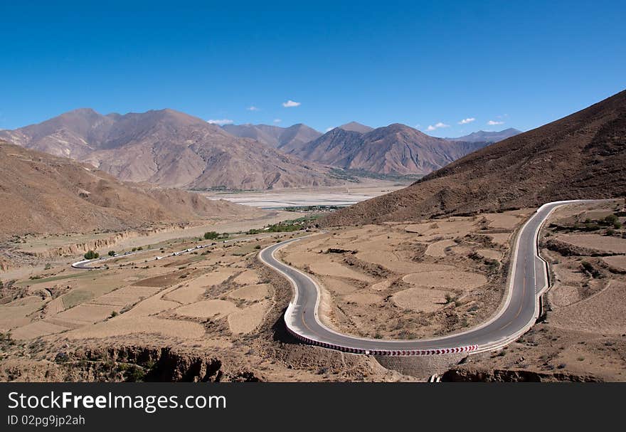 Yellowish mountain road view in tibet of China