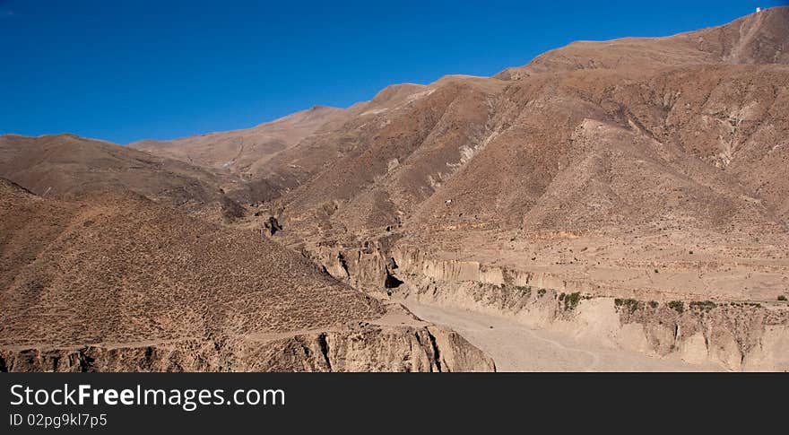 Yellowish mountain road view in tibet of China