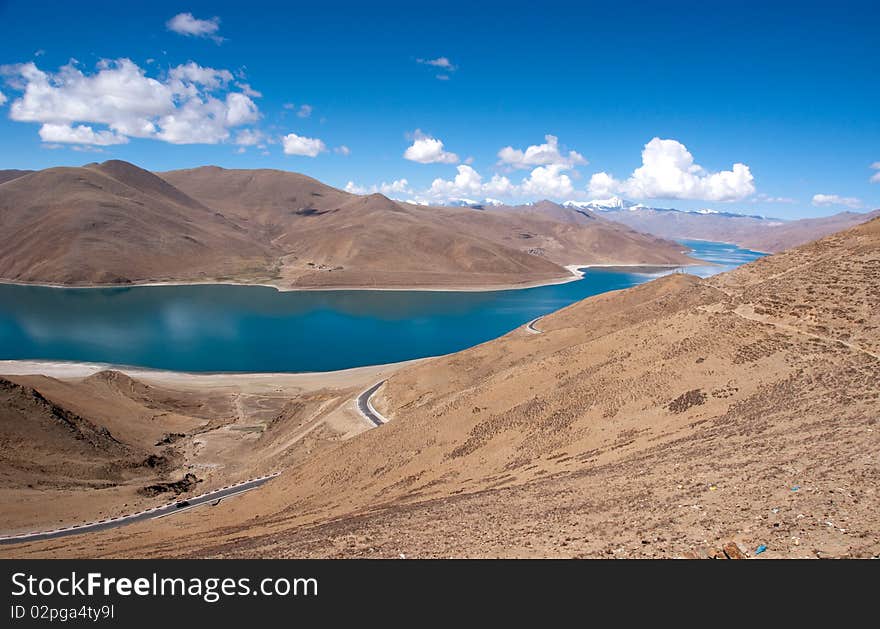 Blue lake with surrounding mountains in great tibet area. Blue lake with surrounding mountains in great tibet area