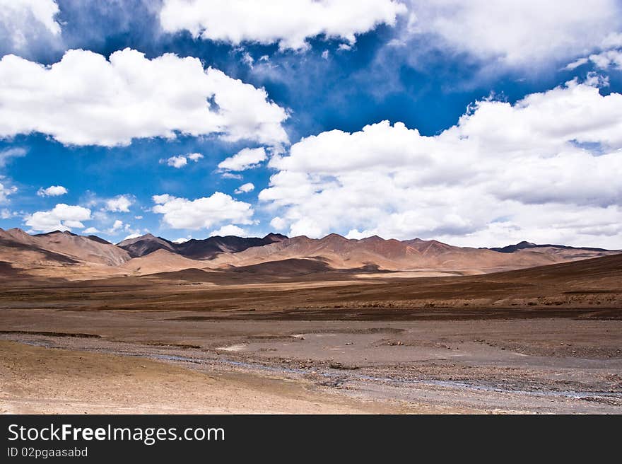 Yellowish mountain road view in tibet of China