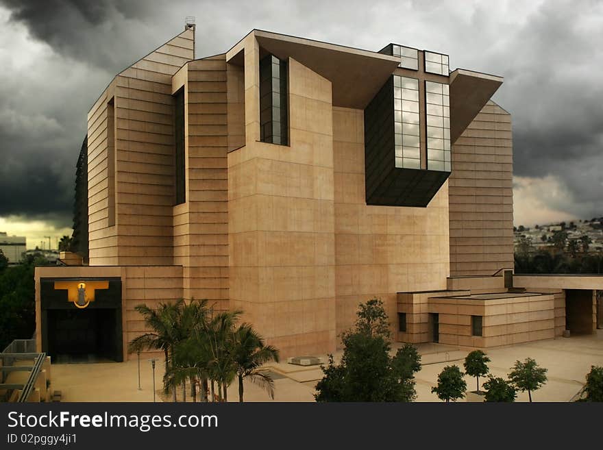 Exterior of a grand modern church building with cloudy sky. Exterior of a grand modern church building with cloudy sky