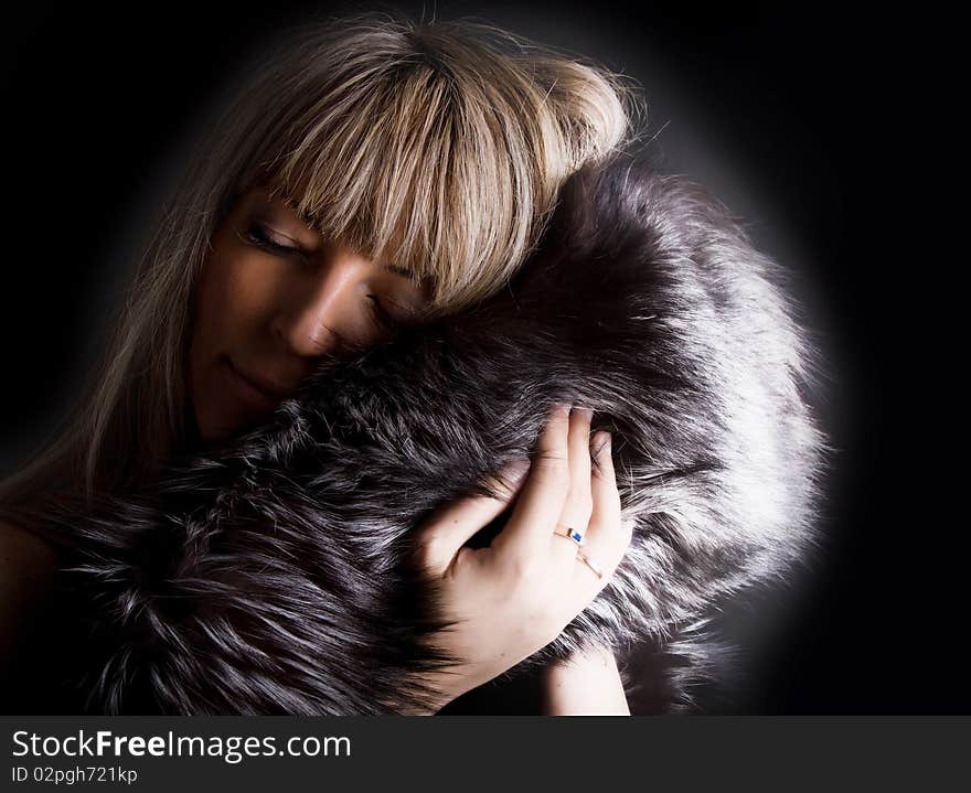 Cute dreaming girl with fur coat. Cute dreaming girl with fur coat