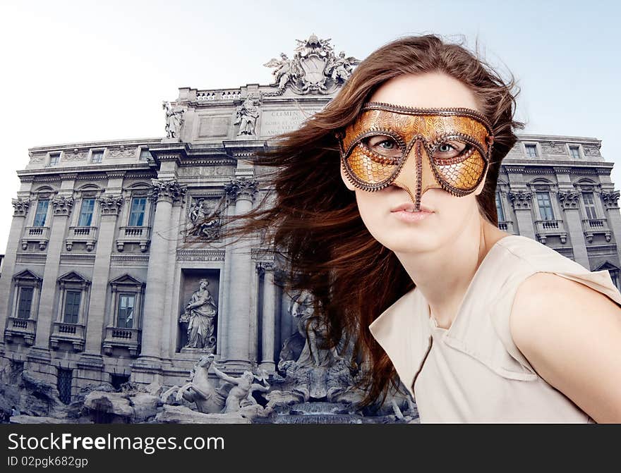 Young beautiful girl with the Venetian mask