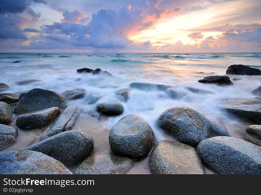 Sea waves lash line impact rock on the beach. Sea waves lash line impact rock on the beach