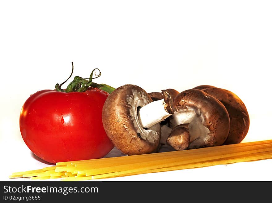 Mushrooms, tomato and spaghetti arrangement isolated