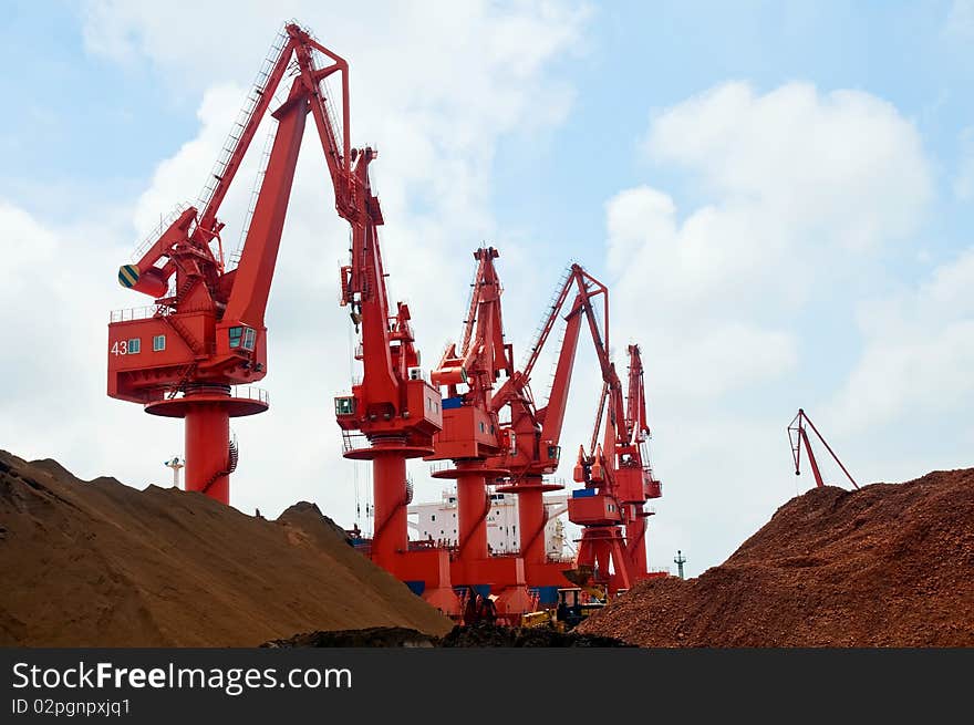 Mang cranes against blue sky，which taken in Qingdao Port China. Mang cranes against blue sky，which taken in Qingdao Port China