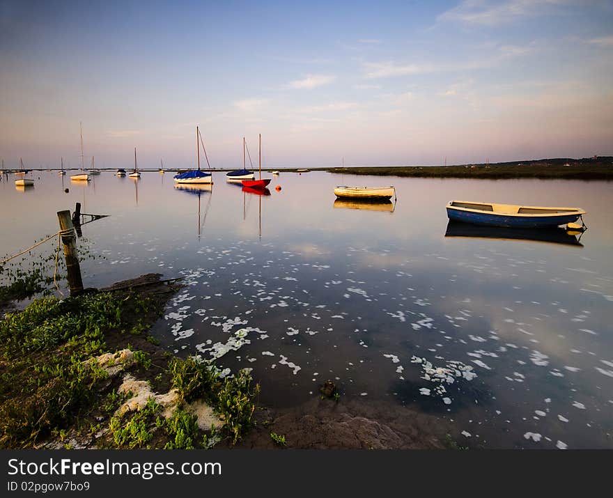 Sailing boats in Morston creek at high tide. Sailing boats in Morston creek at high tide.