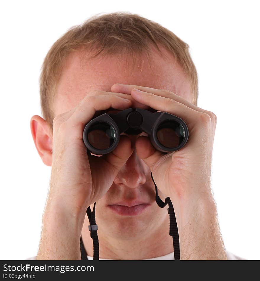 Young man searching for something with binoculars over white background