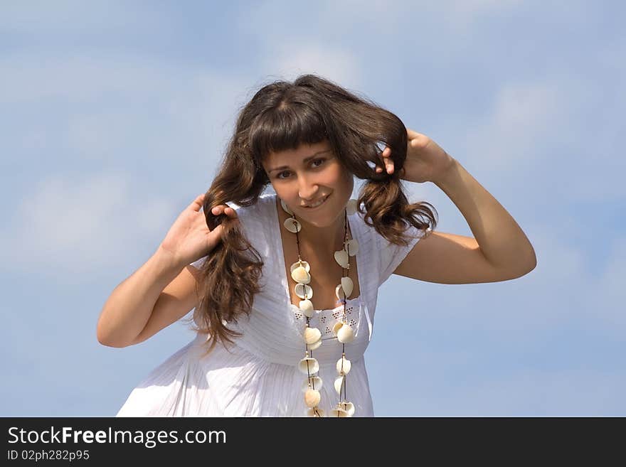 Young  Girl At The Sky Background