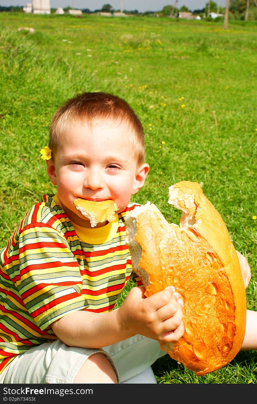 Boy bitten by a loaf of bread