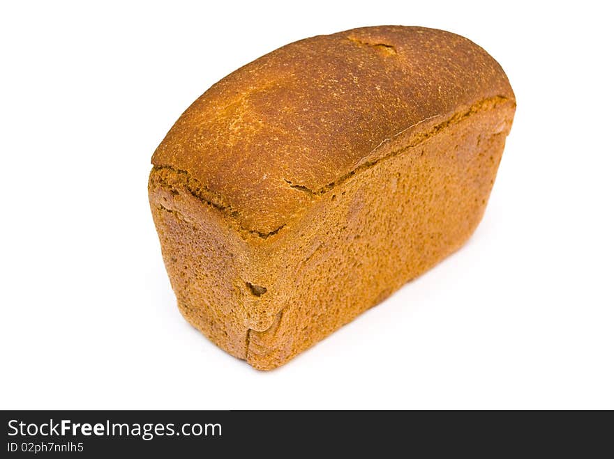 A loaf of fresh rye bread rectangular shape on a white background. A loaf of fresh rye bread rectangular shape on a white background