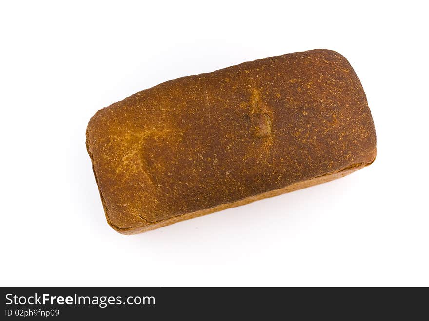 A loaf of fresh rye bread rectangular shape on a white background, top view