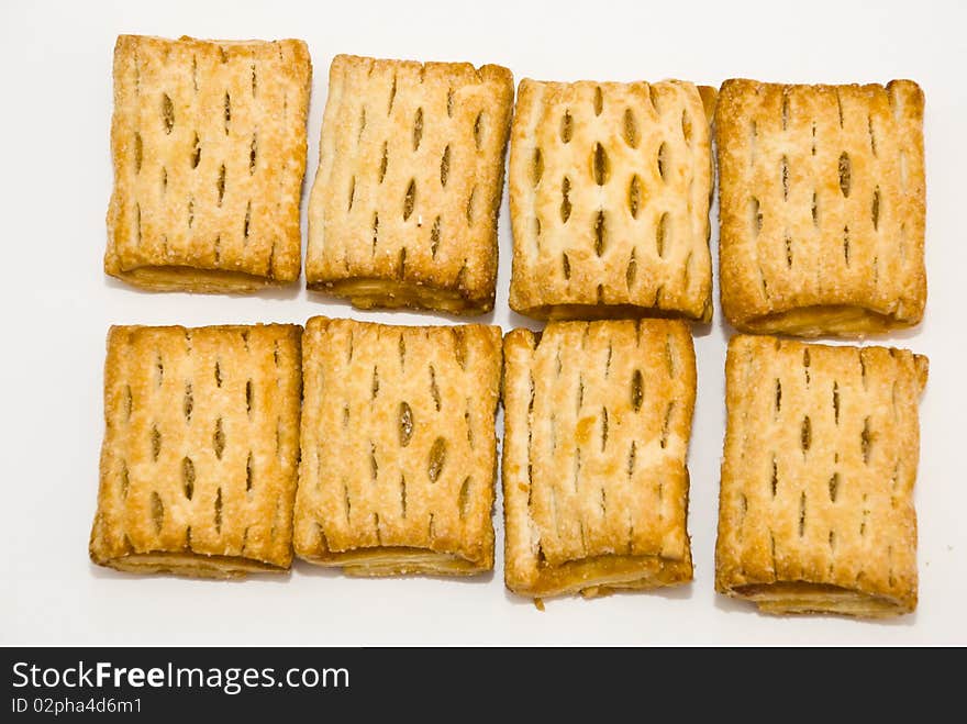 Sweet fresh pies with filling, lying on a white background. Sweet fresh pies with filling, lying on a white background