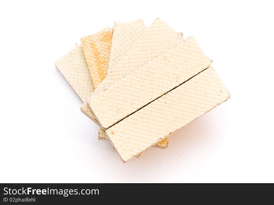 Sweet delicious waffles rectangular underlying spiral, top view, on a white background. Sweet delicious waffles rectangular underlying spiral, top view, on a white background