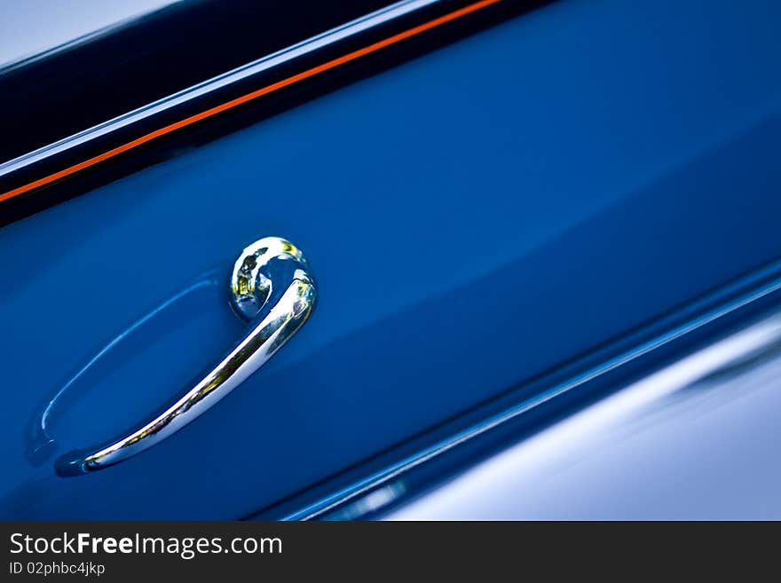 Closeup on shiny door handle of retro car. Closeup on shiny door handle of retro car