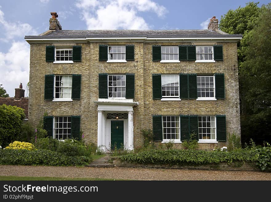 View of a grand old house in a village in Kent, England, which is in need of some repair. View of a grand old house in a village in Kent, England, which is in need of some repair.