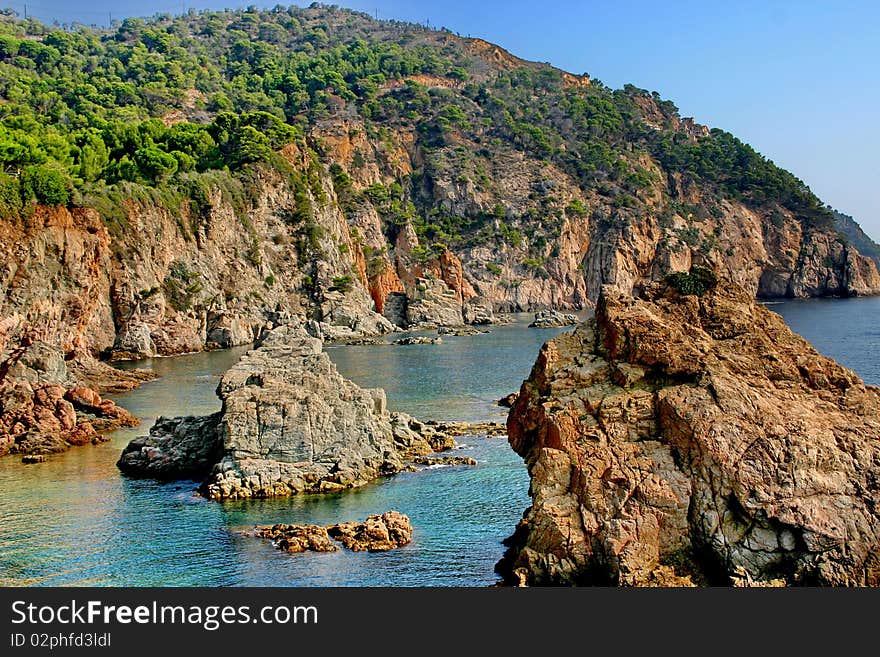 A rocky shore of the Mediterranean Sea and forbidding bay. A rocky shore of the Mediterranean Sea and forbidding bay.