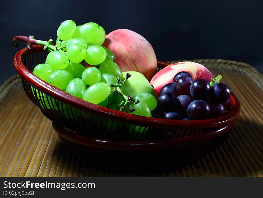 Group of different fruits in  in the technology bamboo tray.