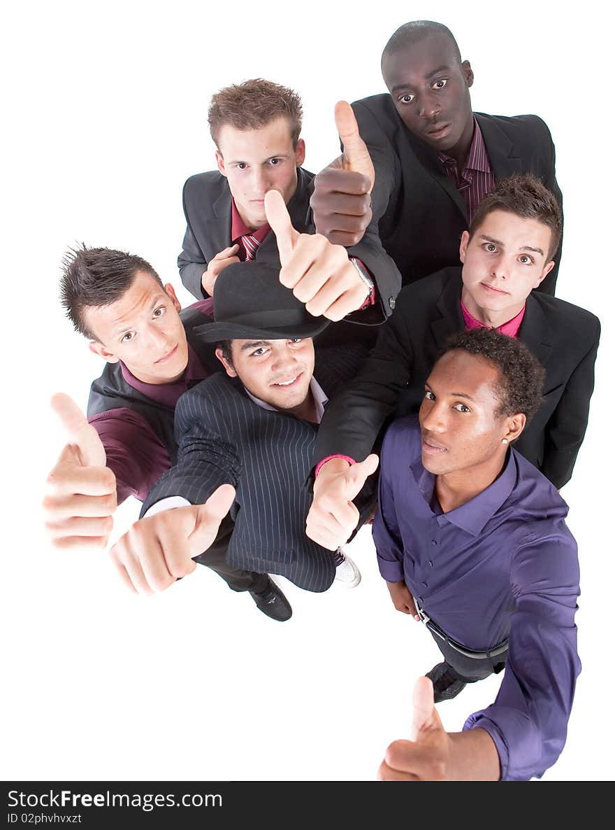 Young interracial group of teenage businessmen giving a thumbs up sign. Fresh trendy models. Young interracial group of teenage businessmen giving a thumbs up sign. Fresh trendy models.