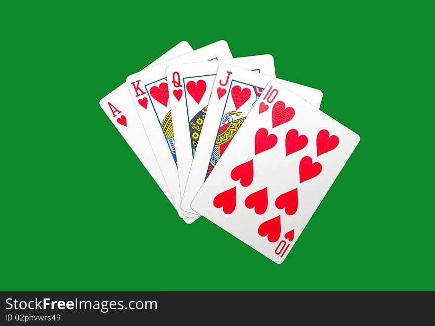 Playing cards isolated against green background