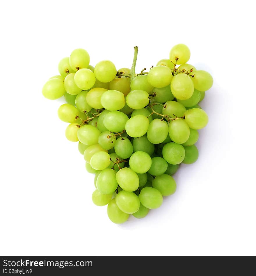 Green grapes against white background.