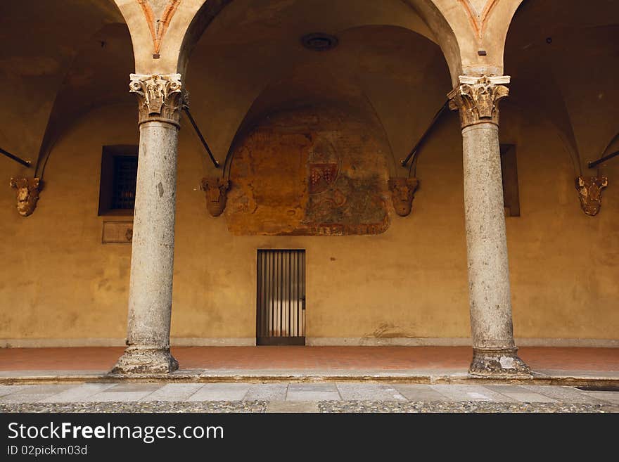 The arch structure of Rocchetta square inside Sforza Castle / Castello Sforzesco in Milan, Italy. The arch structure of Rocchetta square inside Sforza Castle / Castello Sforzesco in Milan, Italy.