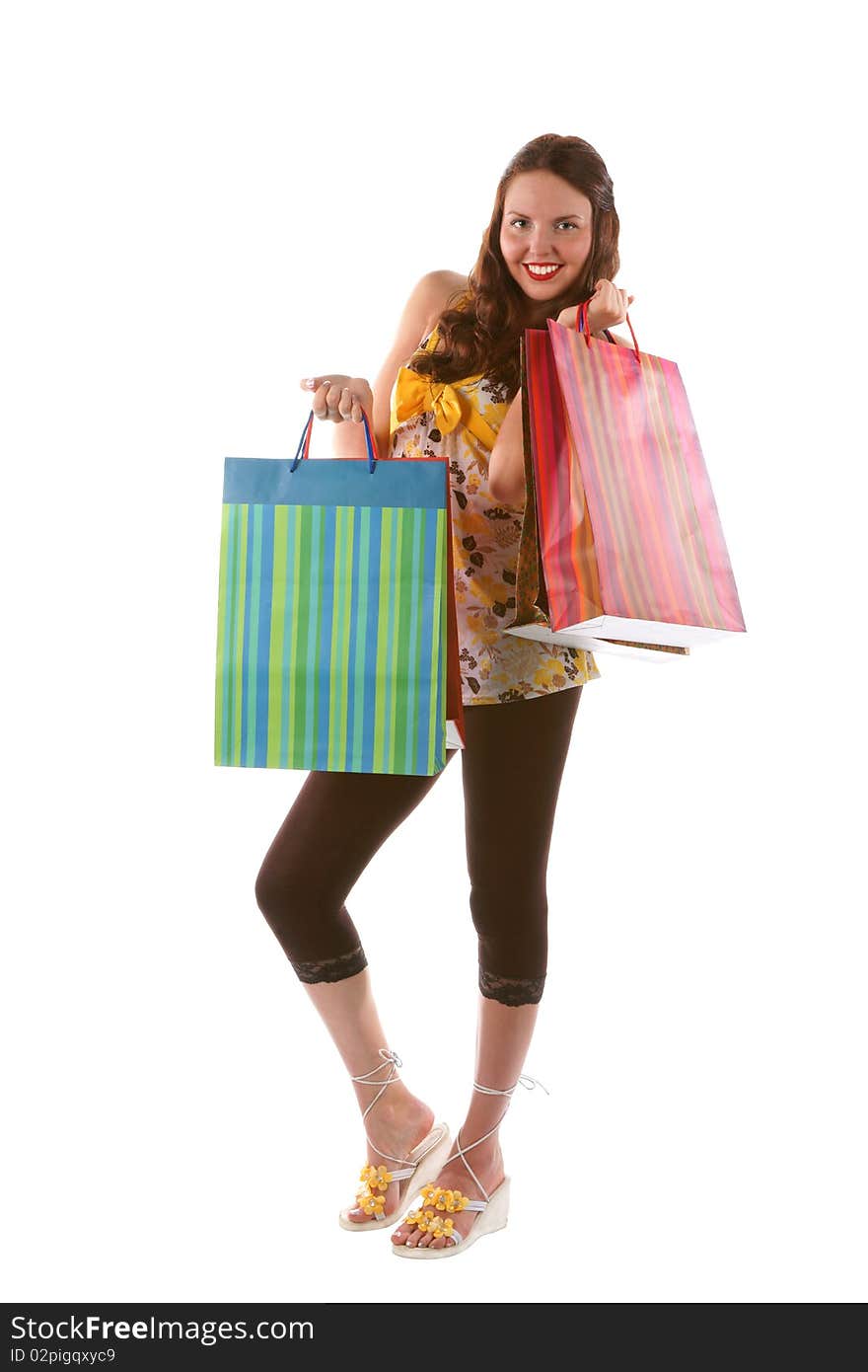 Pretty shopping girl with bags (isolated)