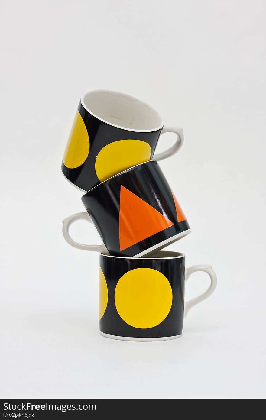 Coffee cups tower on white background