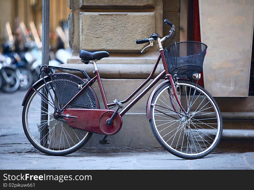 A bicycle parked outside a building in Florence, Italy. Bicycles are common sight in Italian cities and widely used by commuters as a common mode of transport. A bicycle parked outside a building in Florence, Italy. Bicycles are common sight in Italian cities and widely used by commuters as a common mode of transport.