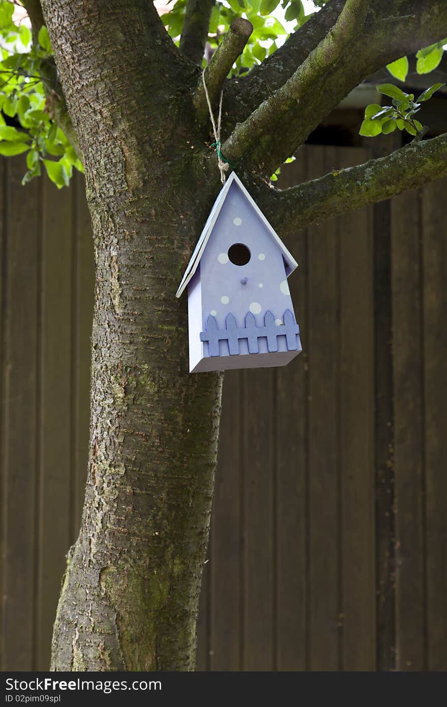 Home-made blue bird house waiting for new occupants.