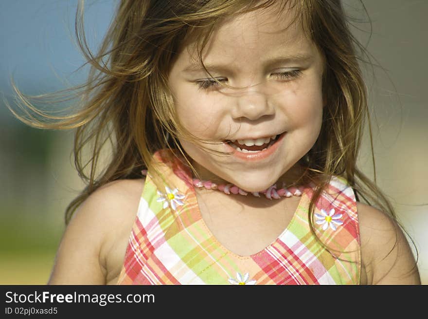 Little girl running in field