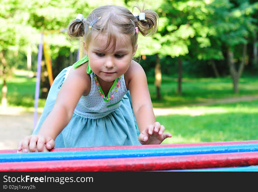 Little girl playing in the green park. Little girl playing in the green park