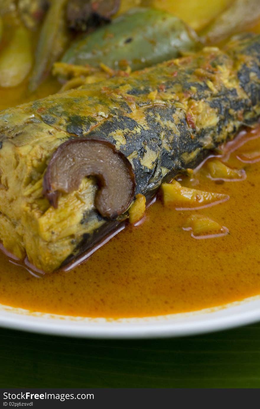 Fish curry on banana leaf background. Fish curry on banana leaf background