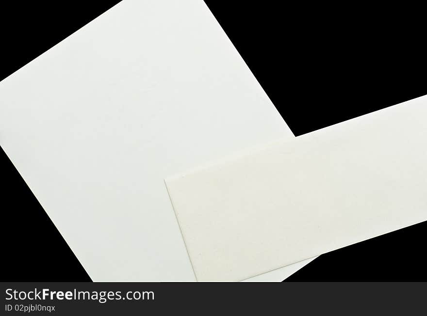 An envelope and a paper black isolation. An envelope and a paper black isolation