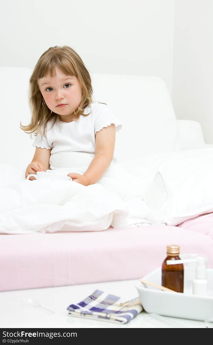 Sick little girl  on bed