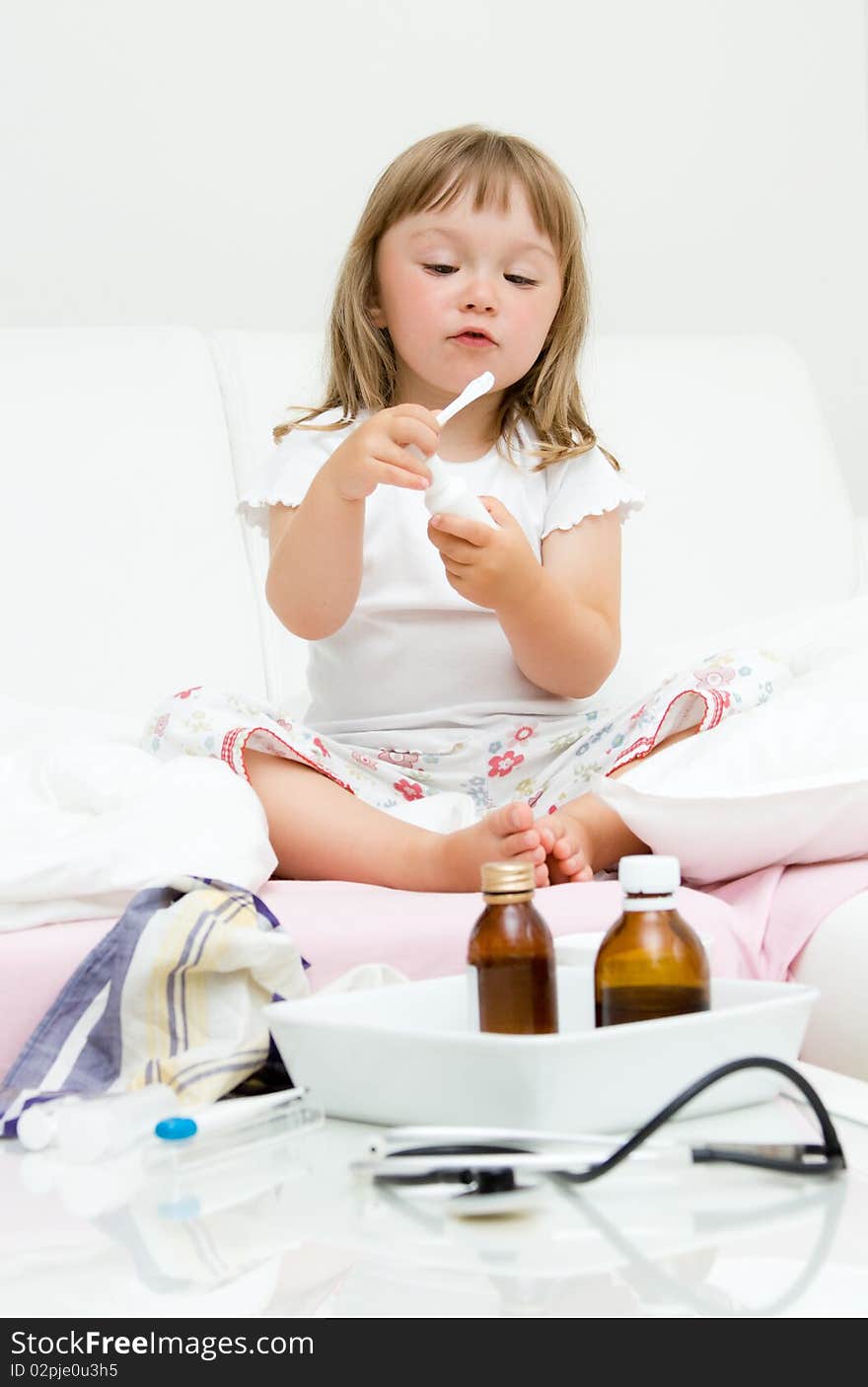 Sick little girl  on bed