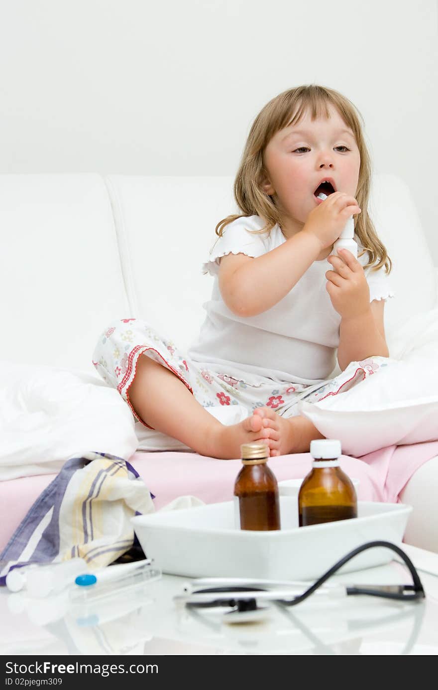 Sick little girl  on bed