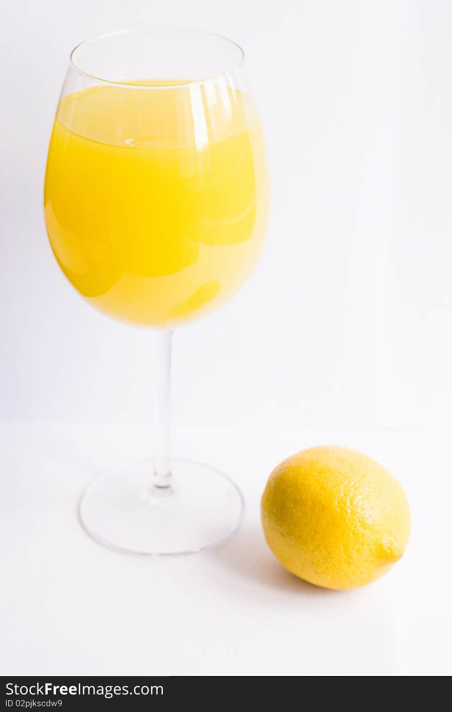 Lemon cocktail with lemon on white isolated background