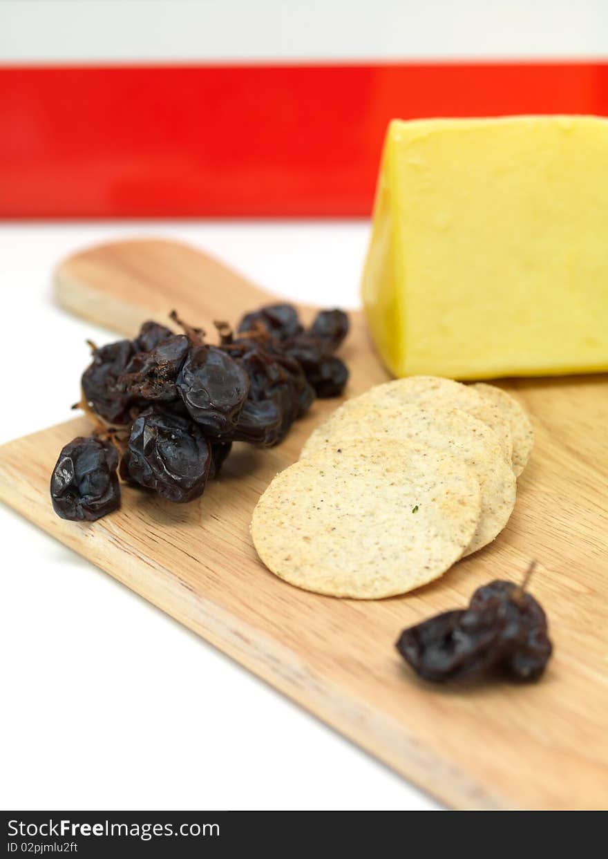 A selection of cheeses on a cutting board. A selection of cheeses on a cutting board