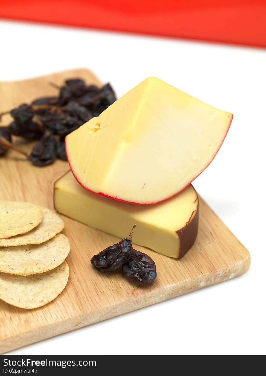 A selection of cheeses on a cutting board. A selection of cheeses on a cutting board