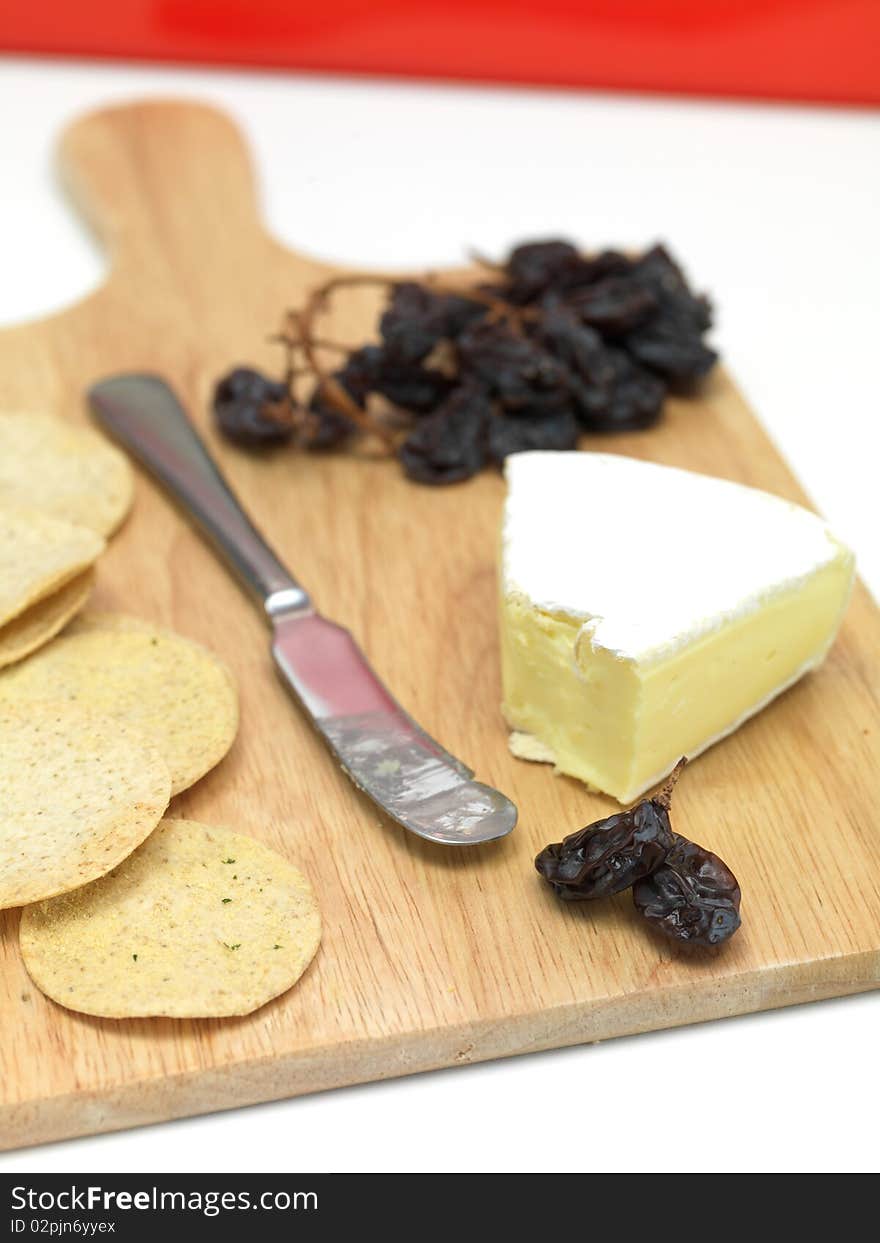 A selection of cheeses on a cutting board. A selection of cheeses on a cutting board