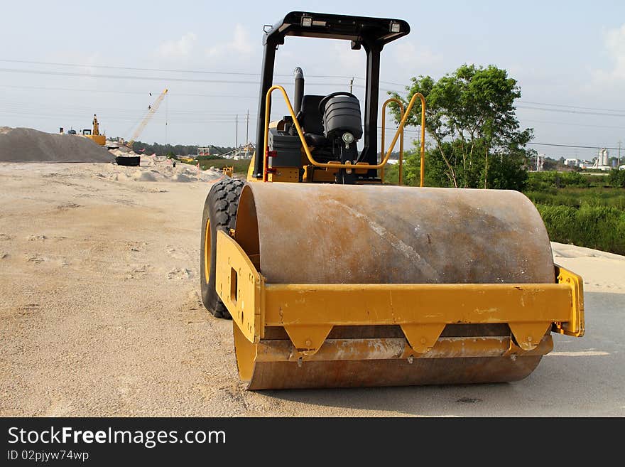 Yellow tractor on construction site