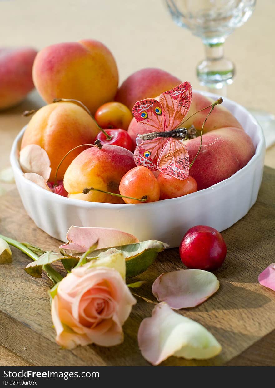 Fresh fruits in bowl with butterfly