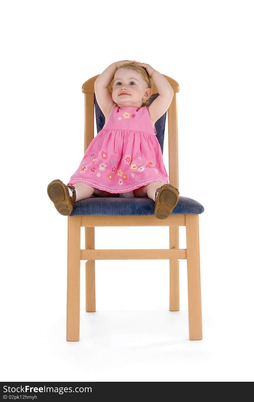 Merry child sit on chair on white background.